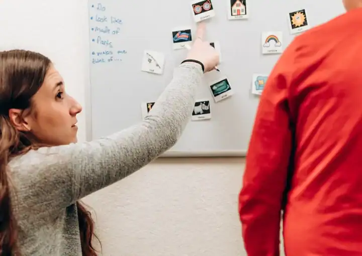 Speech therapy solutions Montana, speech therapy, children, whiteboard, speech therapy session, communication skills, language development, therapy techniques, speech resources, Montana speech therapist.