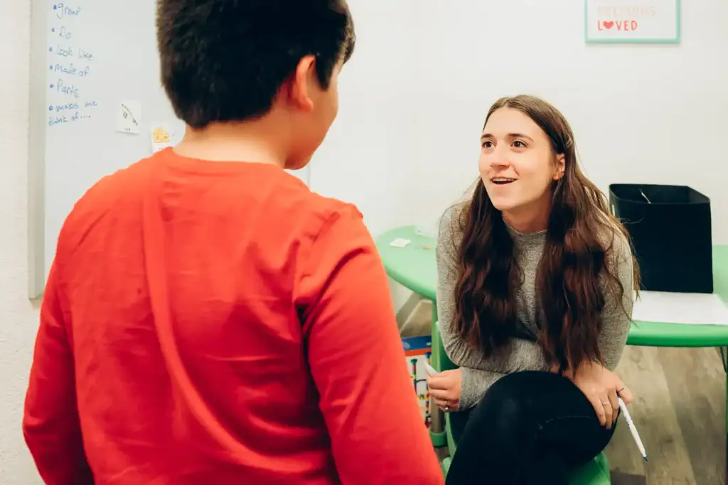 Aunt text: Speech therapy session focusing on language development for children in Montana.