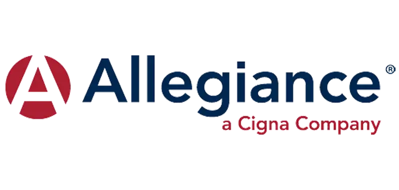 Therapist working one-on-one with a young child during speech therapy session in a clinical setting.
